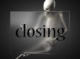 closing word on glass and skeleton photo