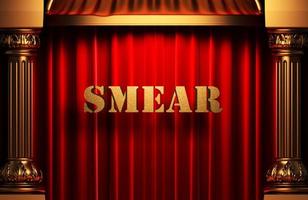 smear golden word on red curtain photo