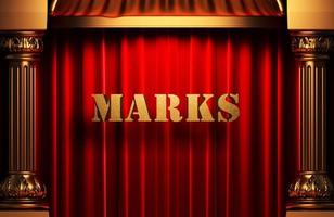 marks golden word on red curtain photo