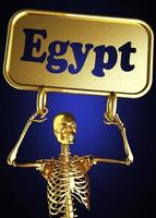 Egypt word and golden skeleton photo