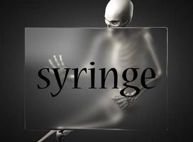 syringe word on glass and skeleton photo