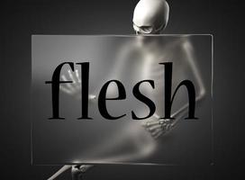 flesh word on glass and skeleton photo