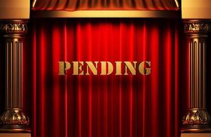 pending golden word on red curtain photo