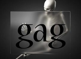 gag word on glass and skeleton photo