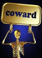 coward word and golden skeleton photo