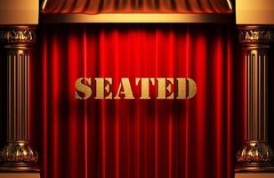 seated golden word on red curtain photo