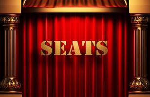 seats golden word on red curtain photo