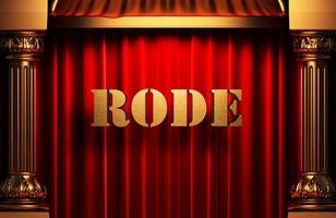 rode golden word on red curtain photo