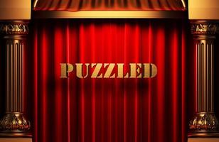 puzzled golden word on red curtain photo