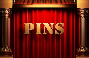 pins golden word on red curtain photo