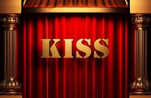 kiss golden word on red curtain photo