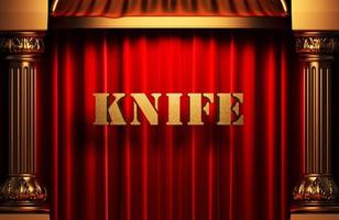 knife golden word on red curtain photo