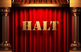 halt golden word on red curtain photo