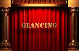 glancing golden word on red curtain photo