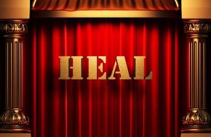 heal golden word on red curtain photo
