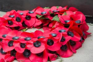 Remembrance Sunday, Memorial day in London. Crown of red poppies in a city garden. photo