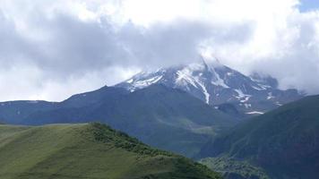 Kazbegi Mountain seen from the Clouds in Kaukaz Mountains, Georgia video