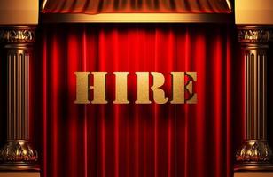 hire golden word on red curtain photo