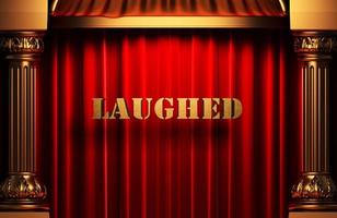 laughed golden word on red curtain photo