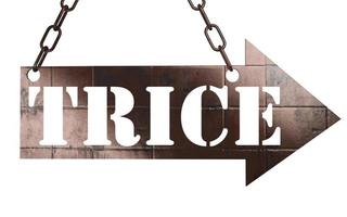 trice word on metal pointer photo