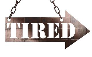tired word on metal pointer photo
