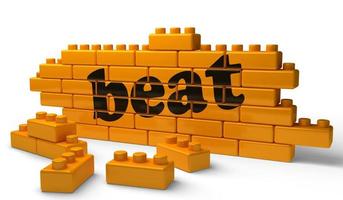 beat word on yellow brick wall photo