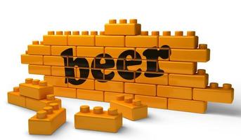 beer word on yellow brick wall photo