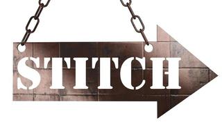 stitch word on metal pointer photo