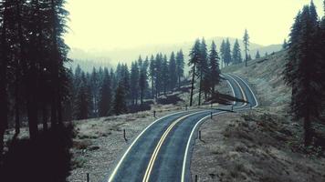 Aerial view of the old road going through pass in the Swiss Alps video