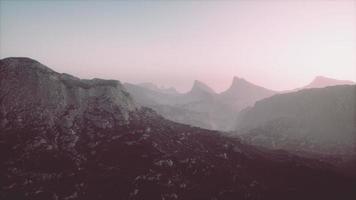 silhouette of swiss alps mountains in morning clouds video