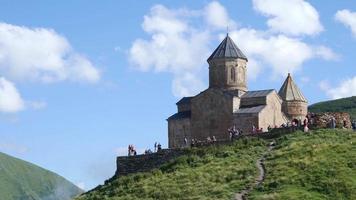Gergeti old christian Church of Georgia on a Kaukaz Mountain in Summer Day video
