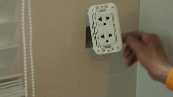 Electrical plug repairs and extension cords by a professional electrician. video