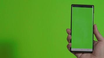 Smartphone screen. Smart phone isolated on color background. video