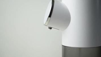 Soap dispenser for liquid soap on a white background. video