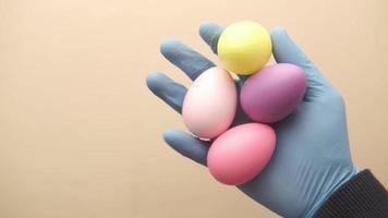 hand in latex gloves holding easter eggs video
