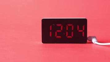 digital clock on red background top down video