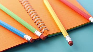 colorful pencils and notepad on table video