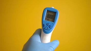 holding a digital thermometer video