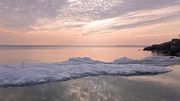 Sunset sky over sea in the evening with colorful clouds video