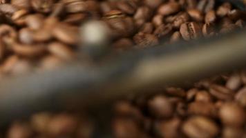 Aromatic Brown Coffee Beans Mixing in an Industrial Roasting Machine to make cooler and ready to Drink video