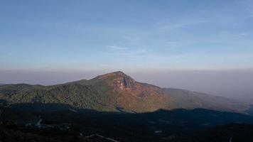 Time lapse of sunset on top of mountain with moving shadow. amazing sunset scenery. video