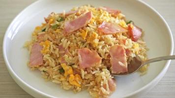 homemade bacon ham fried rice on white plate video