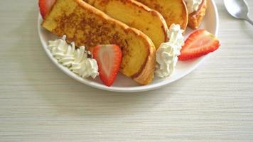 homemade french toast with fresh strawberry and whipping cream