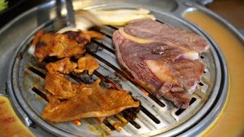 grilled pork and beef meat in Korean style or Korean BBQ video