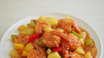 Stir-fried sweet and sour with fried shrimp on plate - Asian food style