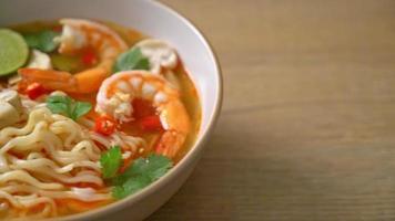 instant noodles ramen in spicy soup with shrimps or Tom Yum Kung - Asian food style video