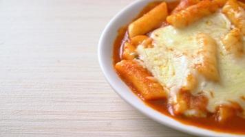 Korean rice cake in spicy Korean sauce with cheese, Cheese Tokpokki, Tteokbokki with Cheese - Korean food style
