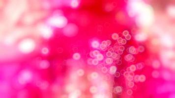 Abstract pink background with moving and glowing bokeh video