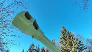 The muzzle of a military cannon against a peaceful sky. Military equipment of the Second World War.