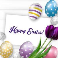 Easter background with colorful eggs, purple tulips and greeting card over white wood.Vector vector